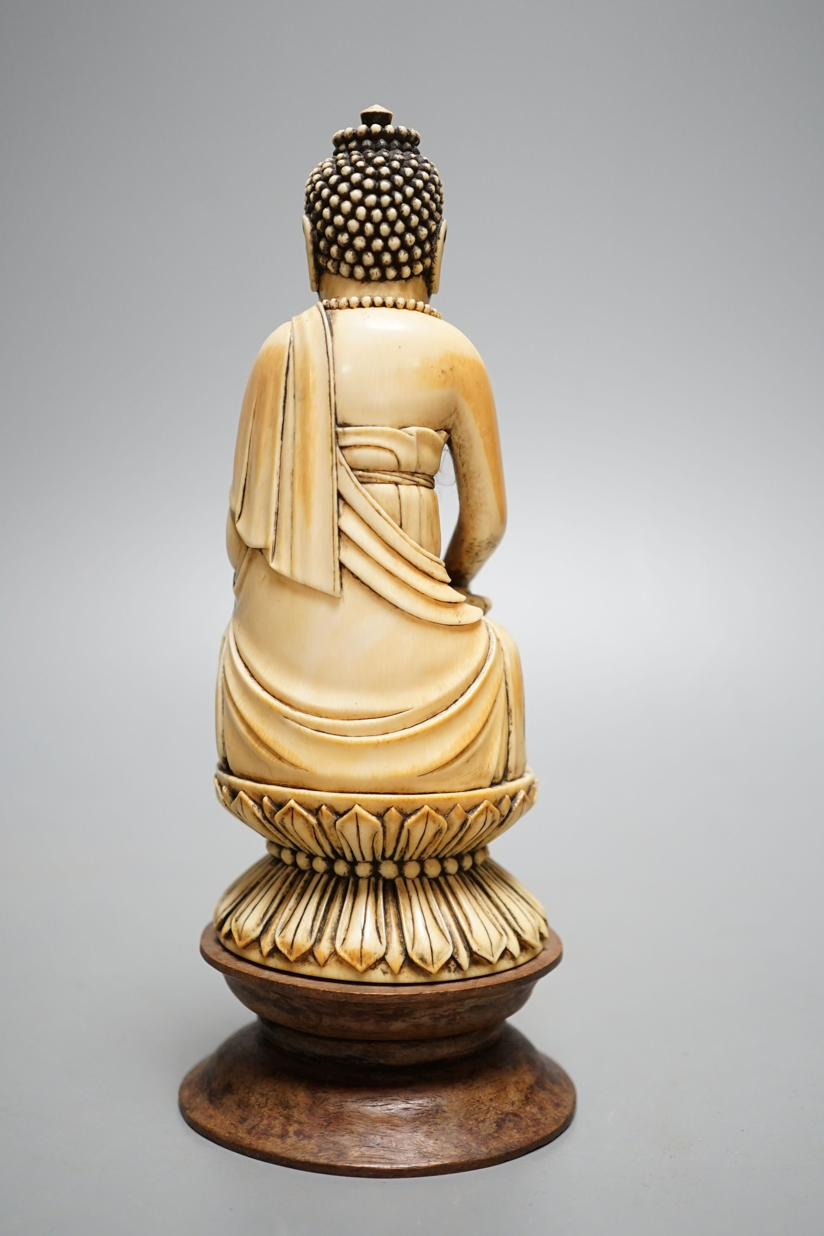 A 19th century Chinese ivory seated figure of Buddha Shakyamuni - 19cm tall